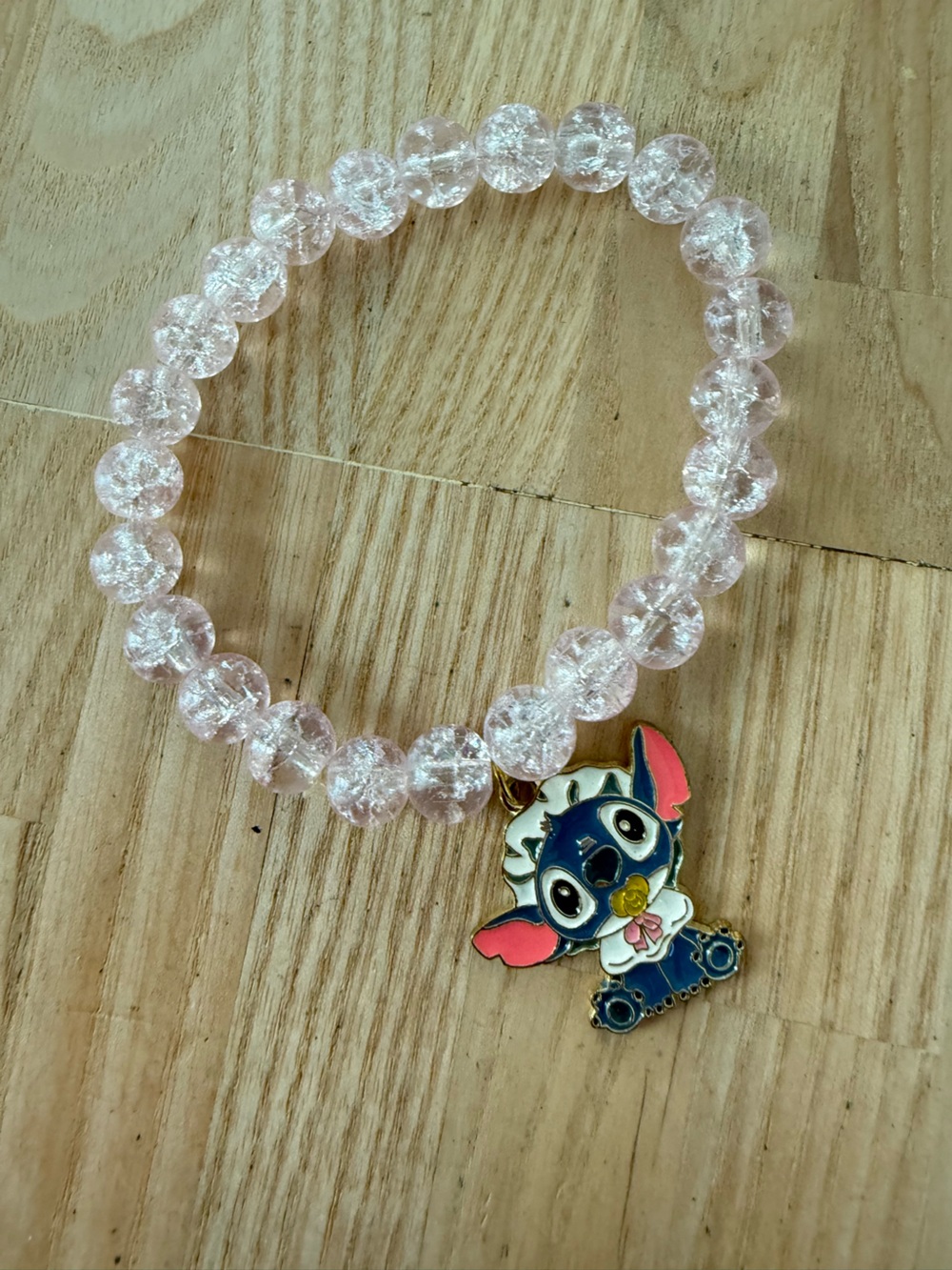 Baby Stitch from LILO & Stitch light pink crackle-glass bead stretch bracelet